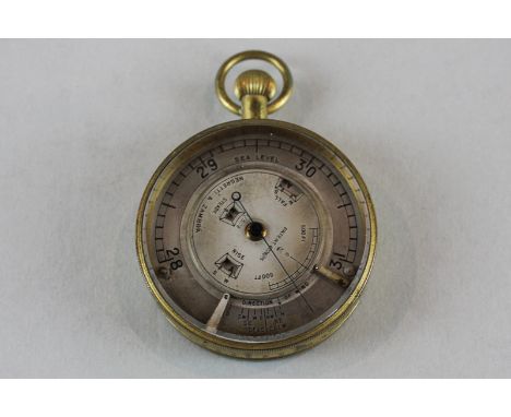 A 19th century Negretti and Zambra pocket barometer with circular dial and scale 28 to 31 inches, and pointer, the outer rim 