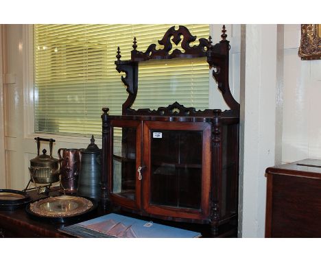 A Victorian walnut wall cabinet with two bow fronted glazed doors and shelf above, 65cm