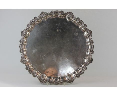 A late Victorian large silver circular salver, maker Richard Martin and Ebenezer Hall Sheffield 1899 and stamped McKay and Ch