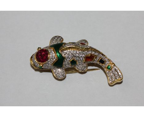 A 'Carp' fish brooch, the body set with small diamonds and decorated with enamel and coloured stones on a gold mount