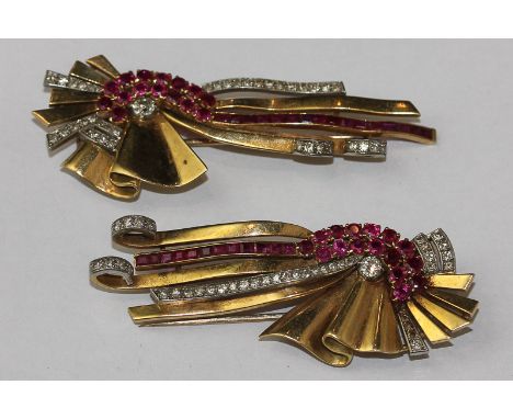 A stylish pair of ruby and diamond clips of fan and ribbon design set with courses of round and square cut rubies and old and