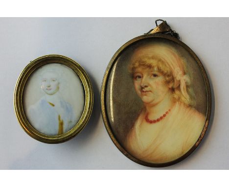 A 19th century oval miniature on ivory of a lady, a scarf holding her hair and wearing a necklace, 7.5cm by 6cm, together wit