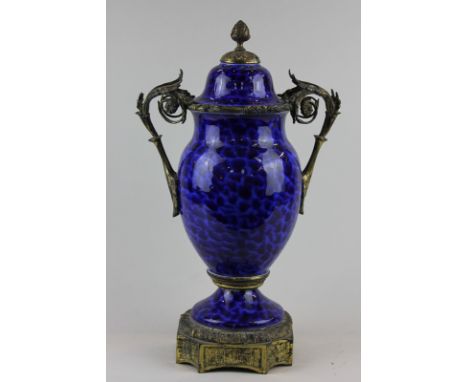 A 19th century ormolu mounted porcelain jar and cover decorated in cobalt and light blue, 42cm high (NC)