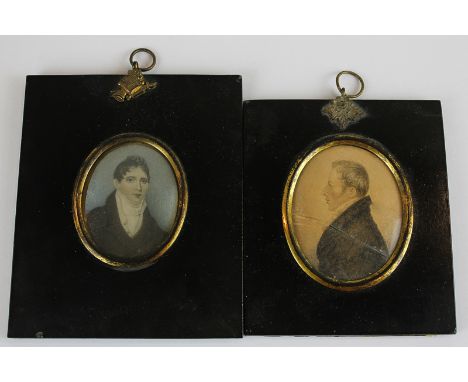 A 19th century oval miniature head and shoulders portrait of a young man wearing a high collar and jacket, 7cm by 5cm, in ebo