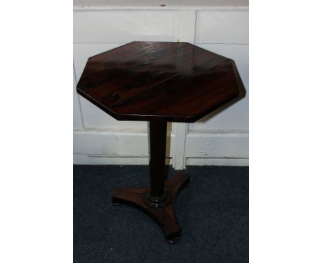 An early 19th century rosewood pedestal table with octagonal top and tapered column on flat tripod base, 54cm