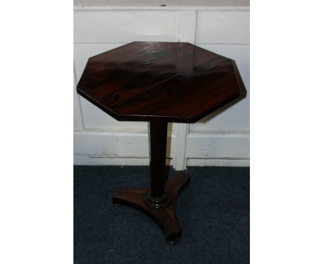 An early 19th century rosewood pedestal table with octagonal top and tapered column on flat tripod base, 54cm