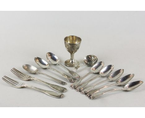 A George IV silver caddy spoon, maker WC London 1823, with flower engraved bowl and fiddle pattern handle, together with a si