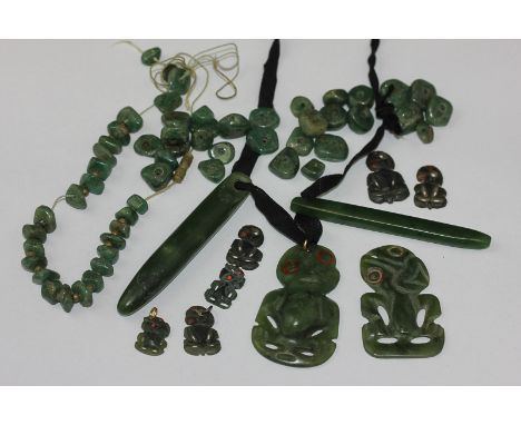 A collection of unstrung jade beads; a pair of jade drops; a pair of carved Maori figure drops (NC)