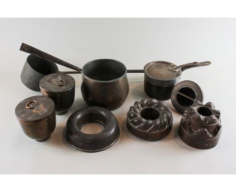 A 19th century copper saucepan with lid, and two copper moulds, stamped EJ (Edward James, formerly at West Dean House), toget