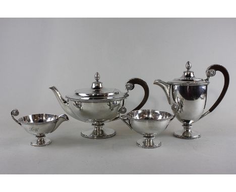 A four piece silver tea set, maker James Dixon and Sons Sheffield 1930/31, with circular bodies and tongue and dart borders, 