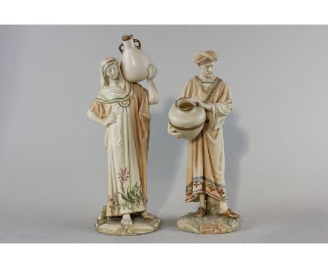 A pair of Royal Worcester porcelain figures of a lady and man, Eastern water carriers, each standing and dressed in long robe