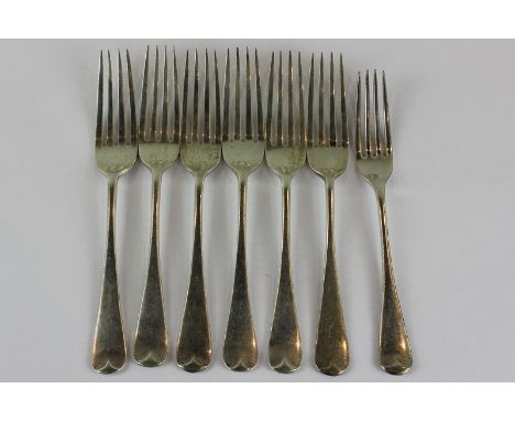 A set of six Edwardian Old English pattern silver dessert forks, London 1906, 10oz, and one plated fork