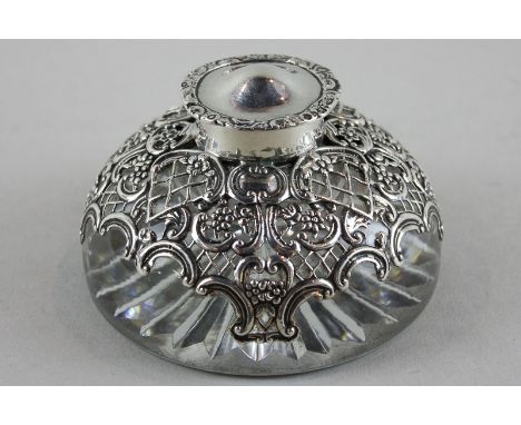 An Edwardian silver mounted and glass desk inkwell with hinged lid, maker William Comyns London 1906