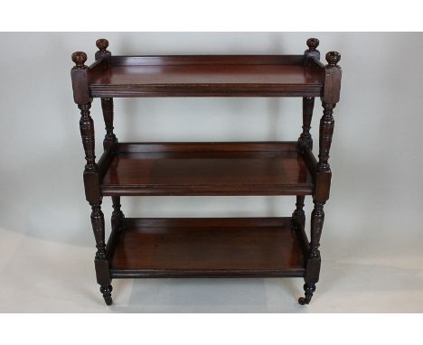 A Victorian three tier mahogany buffet with turned supports and gallery tiers, 92cm