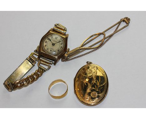 A 9ct gold floral engraved locket; a 9ct gold tie slide; a 22ct gold wedding ring; a 9ct gold Bensons wristwatch on gilt brac