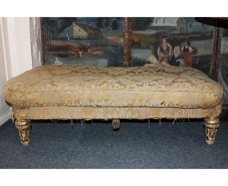 A Regency gilt framed stool on four short turned legs, 116cm by 70cm (NC)