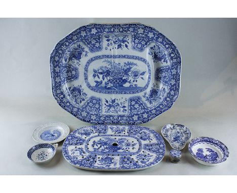 A large 19th century Spode blue and white meat dish with urn of flowers centre and baskets of flowers and floral spray border