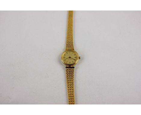 A lady's 9ct gold Tissot bracelet watch