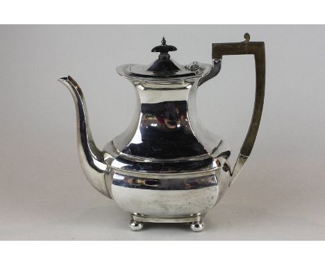 A George V silver coffee pot, baluster shape on ball feet, maker James Deakin and Sons, Sheffield 1918