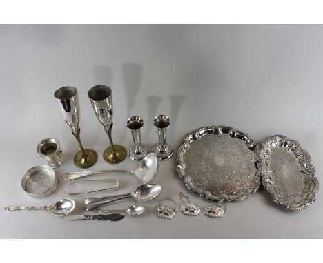 A collection of plated items to include circular tray, soup ladle, biscuit holder, place mats, etc