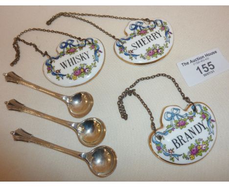 Set of three china decanter labels by Crown Staffordshire, and a set of three silver salt spoons in the Albany pattern, hallm