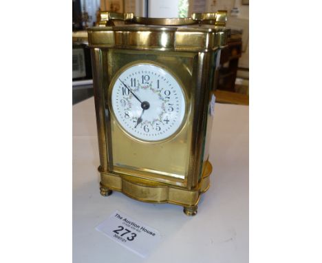Brass carriage clock with circular floral painted enamel dial, 5" tall