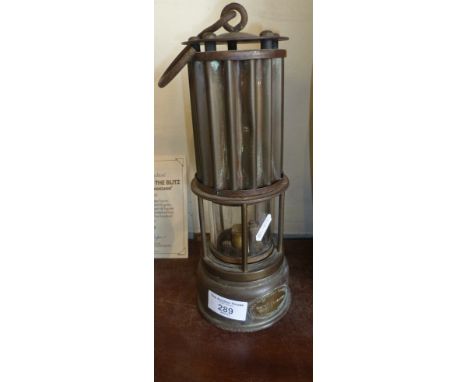 Early 20th c. miner's lamp with ribbed brass canopy and oval brass badge for the Automobile Palace Ltd., Llandrindod Wells