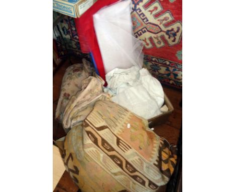 Assorted textiles, large cushion and three bolts of netting