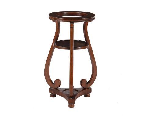 
	
		A Victorian mahogany jardinière stand, mid-19th century, the circular top with aperture for a planter, above a dished sh