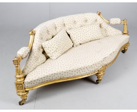 
	
		A Victorian giltwood framed low sofa, floral decoration, 160cms wide, 56cms high
		Provenance: Property from a Private C