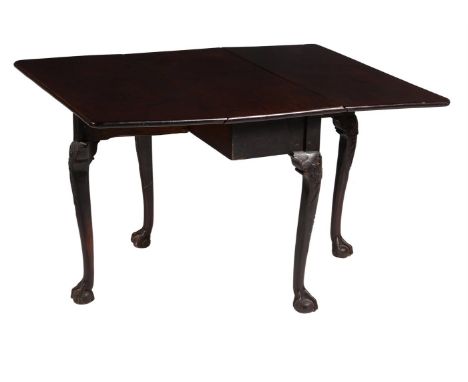 
	
		A George II mahogany drop leaf table, circa 1740, possibly Irish, the twin drop leaves above cabriole legs ending in cla