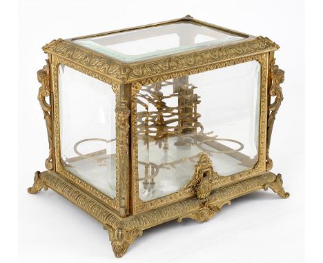 
	
		A late 19th century French gilt metal and bevelled glass cased liquor set, hinged fold over top and sides enclosing lift