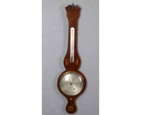 
	
		An early 19th century mahogany wheel barometer, case with broken pediment cornice and inlaid marquetry shells and sunbur