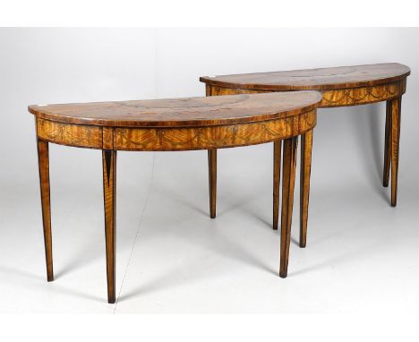 
	
		A pair of George III style mahogany console tables, of demilune outline, modern, with fan inlaid tops, floral swag decor