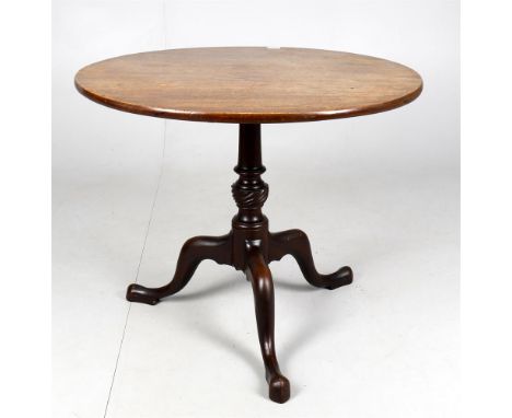 
	
		George III mahogany tripod table, the circular top now fixed, carved stem and spreading base, 83cms diameter, 68cms high