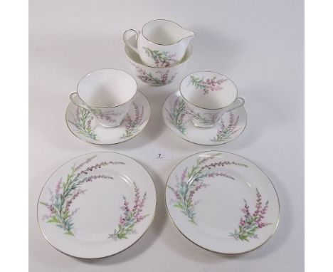 A Royal Doulton tea service printed Bell Heather comprising six cups and saucers, six tea plates, milk and sugar