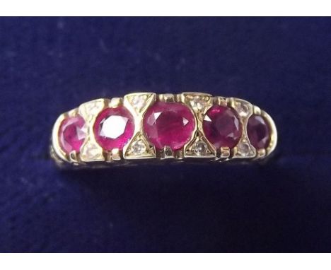 A 9 carat gold ruby and diamond ring, size N