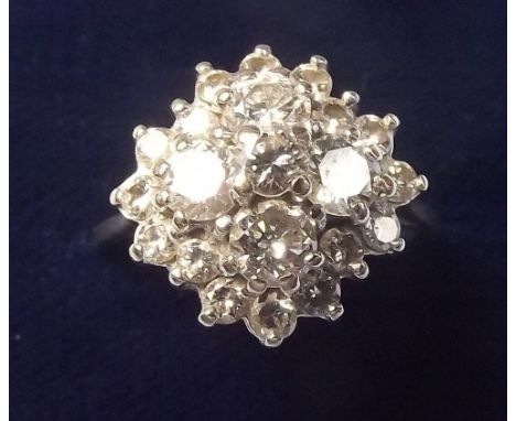 A large 18 carat gold diamond cluster ring - size N