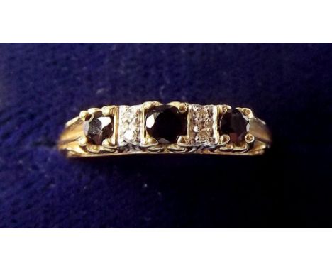 A 9 carat gold sapphire and chip diamond ring - size N