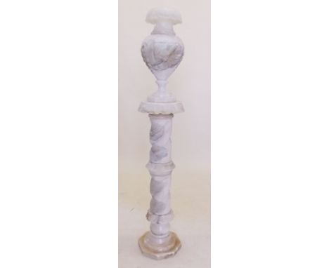 A late 19th century large floor standing alabaster urn form lamp on carved column