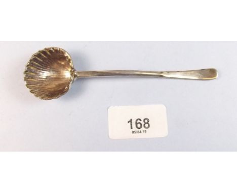 A silver shell bowl caddy spoon