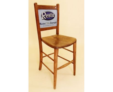 An early 20th century department store chair with enamel double advertising sign back for 'Restu' - 'Washes White Overnight'