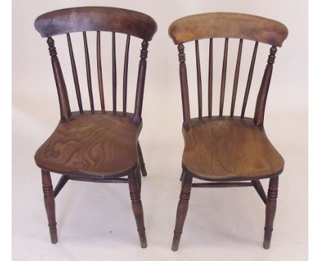 A pair of stick back dining chairs