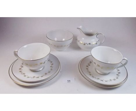 A Royal Doulton twenty one piece tea service 'Citadel' comprising six cups and saucers, six tea plates, sugar, milk and cake 