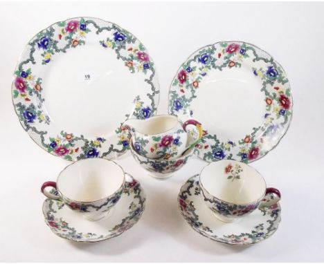 A Royal Cauldon 'Victoria' dinner service comprising: twelve breakfast cups and saucers, six tea cups and saucers, six extra 