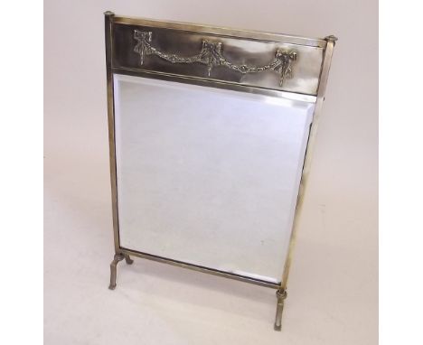An Edwardian brass and mirrored firescreen