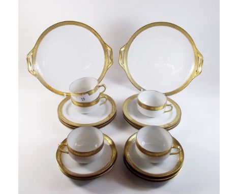 A Haviland Limoges tea service comprising: five gilt edged cups, six saucers, six teaplates and two cake plates