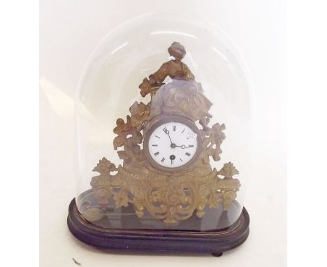 A 19th century French gilt metal mantel clock under glass dome with reclining woman, glass a/f