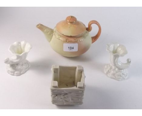 A Locke and Co Worcester ivory blush teapot, a pair of Royal Worcester cornucopia posy vases and a square vase