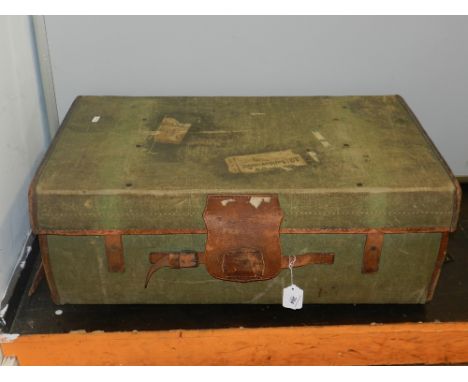 A Hill & Millard travelling trunk, having leather handles and mounts